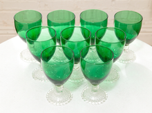 Load image into Gallery viewer, Vintage emerald green glassware set with green goblets on clear textured pedestal stems and coordinating handled green glass pitcher
