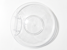 Load image into Gallery viewer, A clear plastic round shallow dish or shallow tray with a small tab on the left side, shown from a top-down view on a white background.
