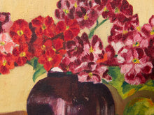 Load image into Gallery viewer, A close-up of a painted floral still life showing red and pink flowers with green leaves in a dark vase against a warm beige background.
