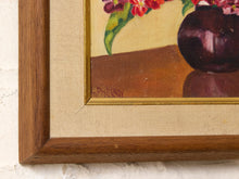 Load image into Gallery viewer, Vintage framed floral still life painting depicting red, pink, and burgundy flowers in a dark rounded vase, with green leaves and a wood frame featuring a textured border and gold trim
