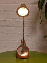 Load image into Gallery viewer, Vintage 1970s orange Space Age desk lamp with chrome adjustable stem, flared shade and circular mirror built into the base.
