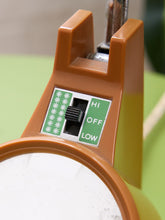 Load image into Gallery viewer, Close-up of the orange desk lamp's black control switch beside the HI, OFF and LOW labels.
