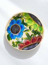 Load image into Gallery viewer, Hand-painted ceramic bowl with large blue and red flowers, chartreuse accents, green leaves, and warm cream background
