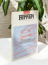 Load image into Gallery viewer, Vintage Rosso Ferrari official magazine featuring illustrated Ferrari 456 GT sports cars and raised 456 GT lettering on the cover
