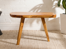 Load image into Gallery viewer, Vintage live edge wood side table with irregular natural wood tabletop, honey-brown grain, visible knots, and three tapered wooden legs
