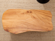 Load image into Gallery viewer, Vintage live edge wood side table with irregular natural wood tabletop, honey-brown grain, visible knots, and three tapered wooden legs
