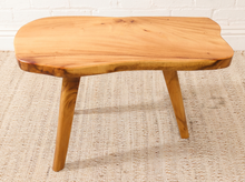 Load image into Gallery viewer, Vintage live edge wood side table with irregular natural wood tabletop, honey-brown grain, visible knots, and three tapered wooden legs

