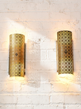 Load image into Gallery viewer, Pair of vintage 1960s metal wall sconces with curved half-cylinder shades, repeating geometric cutout patterns, and rectangular wall mounts
