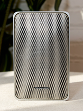 Load image into Gallery viewer, Pair of vintage silver-gray bookshelf stereo speakers with perforated metal front grilles, softly rounded rectangular cabinets, and attached speaker wires

