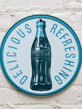 Load image into Gallery viewer, Round Coca-Cola metal advertising sign with silver background, blue Delicious Refreshing lettering, central glass Coke bottle illustration, and blue-green circular border
