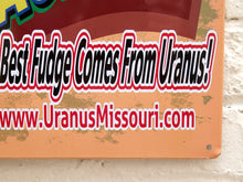 Load image into Gallery viewer, Rectangular Uranus Fudge Factory advertising metal sign with orange background, bold yellow and blue lettering, cartoon gentleman, green Exit 163 sign, and Historic Route 66 graphics
