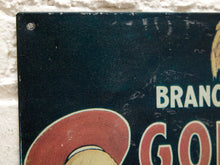 Load image into Gallery viewer, Vintage-style Golden Sheaf Bakery Buster Brown Bread advertising sign with dark background, orange and cream lettering, illustrated Buster Brown character and dog, and distressed surface
