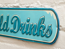 Load image into Gallery viewer, A vintage-style metal sign reading 'Old Drinks' in large teal script on a light blue background, mounted against a white textured wall.
