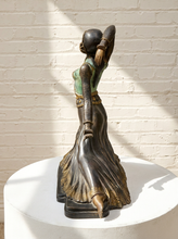 Load image into Gallery viewer, Art Deco bronze dancer sculpture in the style of Dimitri Chiparus depicting Clara in a seated pose with an elaborate headdress, turquoise patinated bodice, gold-tone decorative accents, and a flowing bronze skirt.

