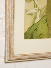 Load image into Gallery viewer, Vintage framed portrait of a Hawaiian hula dancer with floral hair adornment and tropical foliage in muted green and cream tones
