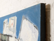Load image into Gallery viewer, Close-up of a framed abstract painting with blue, white, gray, and black brushstrokes, shown against a white brick wall.
