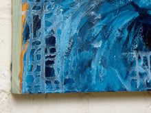Load image into Gallery viewer, Close-up of an abstract blue canvas painting with textured brushstrokes, mounted on a white brick wall.
