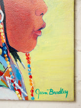 Load image into Gallery viewer, A close-up of a colorful painted portrait on canvas showing part of a person's face in profile with bright multicolored bead details and a yellow background. The artist signature 'Jean Bradley' is painted in green at the lower right.
