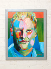 Load image into Gallery viewer, Contemporary portrait painting by Jean Bradley featuring a man with short tousled hair, expressive green, pink, orange, and blue facial tones, and a vibrant blue and orange background.

