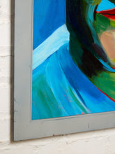 Load image into Gallery viewer, A close-up of a framed abstract painting mounted on a white brick wall. The artwork features bold brushstrokes of blue, green, black, red, and beige, enclosed in a gray frame.
