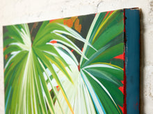 Load image into Gallery viewer, A close-up of a colorful canvas painting featuring green palm leaves with white, yellow, and orange highlights, mounted on a textured off-white wall.
