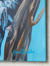 Load image into Gallery viewer, A close-up of a textured canvas painting featuring a dark brown tree trunk with blue, black, and orange brushstrokes against a bright blue background, signed 'Jan Bradley'.
