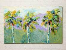 Load image into Gallery viewer, Contemporary landscape painting by Jean Bradley featuring colorful palm trees with yellow, turquoise, orange, and green fronds against lavender mountains, sage green foliage, and a softly painted blue sky.
