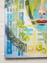 Load image into Gallery viewer, An abstract mixed-media painting on canvas featuring a stylized face with blue, yellow, green, and white brushstrokes, hanging against a white brick wall.
