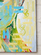 Load image into Gallery viewer, Abstract canvas wall art featuring expressive brushstrokes and layered shapes in light blue, yellow, green, white, and touches of red and purple, shown hanging against a white brick wall.
