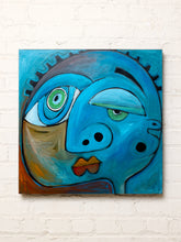 Load image into Gallery viewer, Abstract face painting by Shawn Savage featuring an exaggerated turquoise and blue face with asymmetrical green eyes, rounded nose, golden lips, and expressive curved shapes against a teal background.
