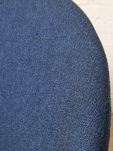 Load image into Gallery viewer, Image 10 of 17: Close-up of a textured blue upholstered surface, likely a chair or cushion, with a curved edge against a light neutral background.
