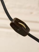 Load image into Gallery viewer, Image 21 of 23: A close-up of a black leather cord with a dark brown plastic toggle clasp, set against a light beige background.
