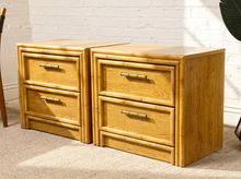 Load image into Gallery viewer, Image 2 of 21: Vintage honey oak nightstand featuring two drawers, natural wood grain, rounded faux-bamboo trim, and antique brass-tone horizontal handles, available as a pair.
