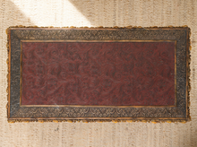 Load image into Gallery viewer, Image 7 of 20: Antique rectangular bamboo-style accent table featuring a dark brown embossed decorative tabletop, ornate gold-tone floral trim, slender golden bamboo legs, crossbar supports, and sculptural pineapple-like feet.

