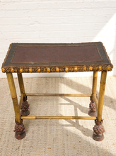 Load image into Gallery viewer, Image 9 of 20: Antique rectangular bamboo-style accent table featuring a dark brown embossed decorative tabletop, ornate gold-tone floral trim, slender golden bamboo legs, crossbar supports, and sculptural pineapple-like feet.
