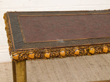 Load image into Gallery viewer, Image 10 of 20: Antique rectangular bamboo-style accent table featuring a dark brown embossed decorative tabletop, ornate gold-tone floral trim, slender golden bamboo legs, crossbar supports, and sculptural pineapple-like feet.

