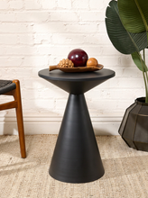 Load image into Gallery viewer, Image 1 of 14: Modern round black side table featuring a smooth circular tabletop, matte black finish, and sculptural tapered cone-shaped pedestal base with subtle surface marks.
