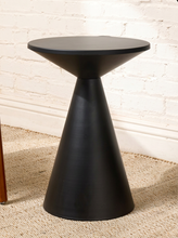 Load image into Gallery viewer, Image 5 of 14: Modern round black side table featuring a smooth circular tabletop, matte black finish, and sculptural tapered cone-shaped pedestal base with subtle surface marks.
