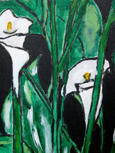 Load image into Gallery viewer, Image 3 of 8: Floral still life painting featuring white calla lilies with yellow centers, large sweeping green leaves, a white vase, and two red peppers on a brown tabletop against a solid black background.
