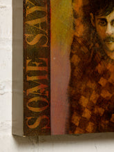 Load image into Gallery viewer, Image 5 of 9: A close-up of a textured canvas print featuring a portrait of a man with a mustache and the words 'SOME SAY' in large distressed lettering, mounted on a white brick wall.
