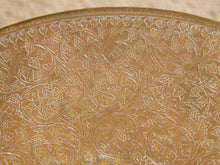 Load image into Gallery viewer, Image 8 of 13: Close-up of an ornate golden-brown plate or tray featuring intricate embossed floral and vine patterns.
