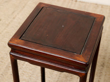 Load image into Gallery viewer, Image 9 of 16: A square dark brown wooden side table or stool with a glossy finish, featuring a recessed center panel on the top and four legs, shown on a textured beige carpet.
