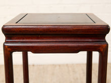 Load image into Gallery viewer, Image 11 of 16: A square dark reddish-brown wooden side table with a smooth top and four legs, photographed against a light off-white brick wall and beige floor.

