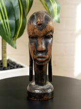 Load image into Gallery viewer, Image 1 of 13: Vintage dark carved wood African-style figural bust with elongated face and decorative hair details
