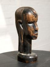 Load image into Gallery viewer, Image 4 of 13: A carved wooden African-style bust sculpture of a human head in profile, mounted on a round base, photographed against a light neutral background.
