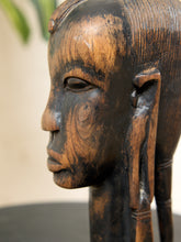 Load image into Gallery viewer, Image 12 of 13: Close-up side profile of a carved wooden sculpture of a human head with detailed facial features and textured hair, shown against a softly blurred neutral background.
