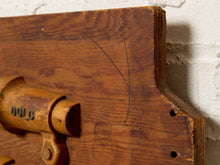Load image into Gallery viewer, Image 6 of 9: A close-up of a rustic wooden wall-mounted sculpture or decor piece with a cylindrical wooden element, set against a white textured wall.

