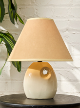 Load image into Gallery viewer, Image 1 of 14: Vintage table lamp featuring a glossy white rounded sculptural base with a raised circular opening and a wide tapered ivory fabric shade.

