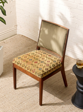 Load image into Gallery viewer, Image 1 of 15: Vintage wooden side chair featuring a square sage green upholstered backrest, cushioned floral tapestry seat with diamond lattice patterns in burgundy, blue, olive, and golden beige, and slender tapered wooden legs.
