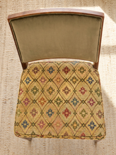 Load image into Gallery viewer, Image 6 of 15: An antique upholstered wooden chair viewed from above, featuring a patterned seat cushion in beige with a multicolor diamond motif and a muted green velvet backrest.
